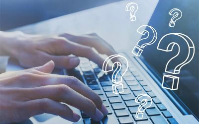 Photo of hands typing on a laptop with question marks over it. This illustrates the article Deception Detection: 3 Questions to Ask