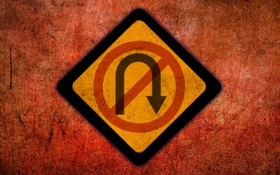 Graphic of a stylized no U-turn sign to illustrate the article Are We at the Point of No Return?