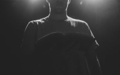 Silhouette of a man holding an open Bible to illustrate the article Faith of the Apostle Thomas: Don’t Call Him Doubting Thomas