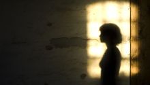Silhouette of a lady against a lighted window, to illustrate the article Jezebel in the Bible